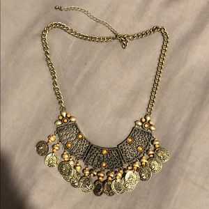 Gold necklace with orange accents!